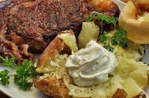 Ribeye_and_baked_potato_(13273850843)